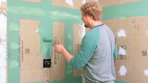 cheapest way to waterproof a shower wall?